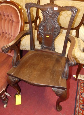 Lot 1442 - A mahogany floral raised and relief carved...