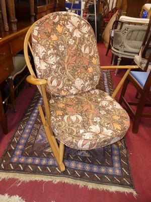 Lot 1445 - An Ercol light elm and beech stickback rocking...