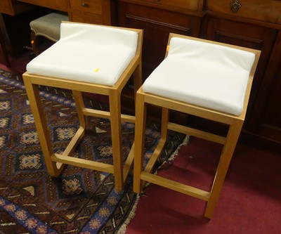 Lot 1457 - A pair of blond oak and leather pad seat...