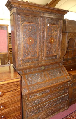 Lot 1470 - An antique and later floral blind carved oak...