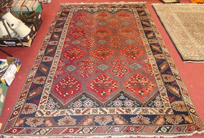 Lot 1499 - A Turkish red ground Kazak rug, with multiple...