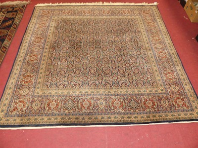 Lot 1500 - A Persian blue ground Qum rug, with all over...