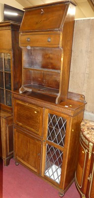 Lot 1476 - A 1930s beaded oak ledge back combination...