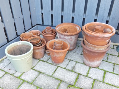 Lot 1494 - A collection of various sized terracotta plant...
