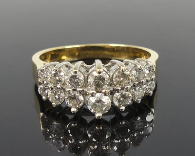 Lot 2503 - An 18ct yellow and white gold diamond two row...