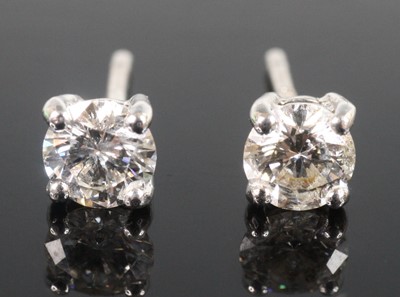 Lot 2519 - A pair of 18ct white gold diamond stud...