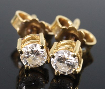 Lot 2543 - A pair of yellow metal diamond single stone...