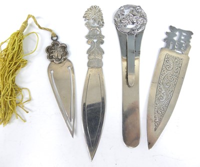 Lot A collection of four Far Eastern silver clip...