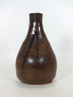 Lot 76 - A brown glazed studio pottery vase, with black...