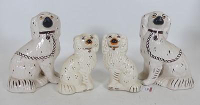 Lot 109 - A pair of Victorian Staffordshire spaniels,...