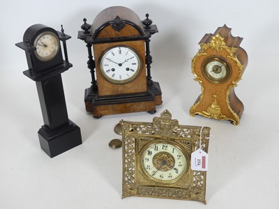 Lot 154 - An early 20th century brass strut clock, the...