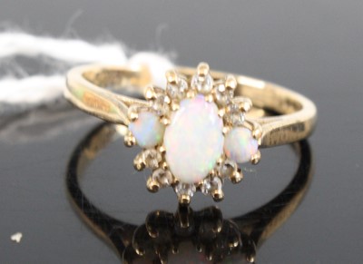 Lot 327 - A 9ct gold opal and diamond point set cluster...