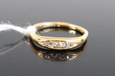 Lot 334 - An 18ct gold diamond ring, arranged as five...