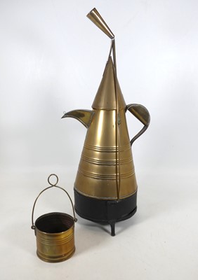 Lot 185 - A Kenyan style brass coffee pot, on black...