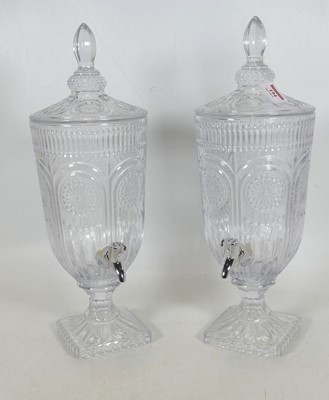 Lot 194 - A pair of moulded glass pedestal urns, each...