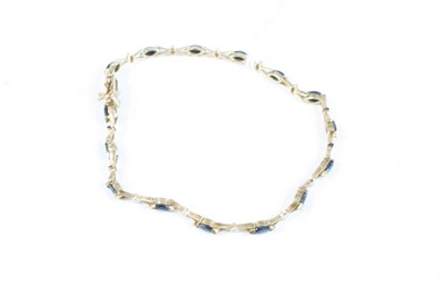 Lot 345 - A modern yellow metal sapphire and diamond...