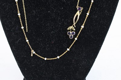 Lot 348 - A 9ct gold amethyst set pendant on finelink...