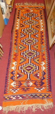 Lot 1203 - A Turkish Iznik woollen bright coloured hall...