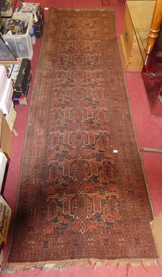 Lot 1204 - A Persian woollen red ground Gharajeh hall...