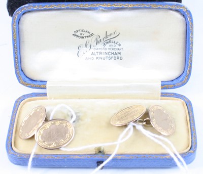 Lot 362 - A pair of 9ct gold and engraved oval cufflinks...