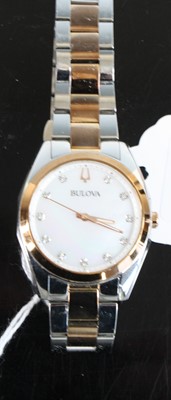 Lot 371 - A lady's Bulova steel and rose gold plated...