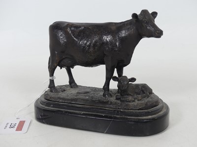 Lot 228 - A contemporary bronze figure group of a cow &...