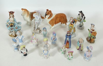 Lot 244 - A collection of porcelain figures, to include...