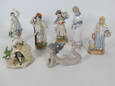 Lot 245 - A collection of figures, to include a pair of...
