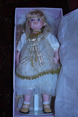Lot 591 - Four various boxed porcelain collectors' dolls