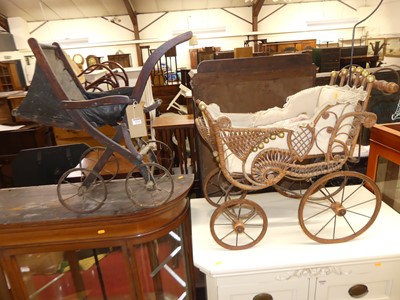 Lot 1242 - Two vintage dolls prams
