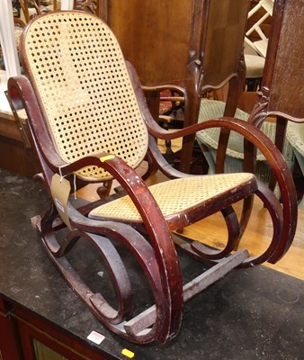 Lot 1281 - A stained and curved wood framed and cane...