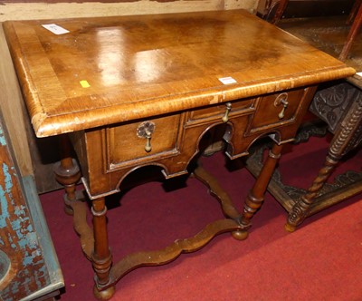 Lot 1289 - A figured walnut and crossbanded three-drawer...