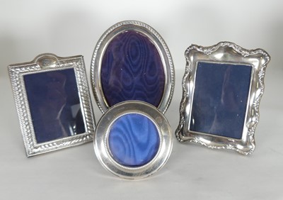 Lot 301 - A modern silver-clad easel photograph frame,...