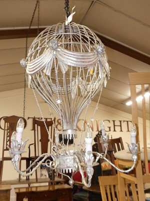 Lot 1318 - A pair of silvered wired metal hanging six...