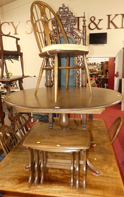 Lot 1320 - An Ercol mid-elm dining suite, comprising;...