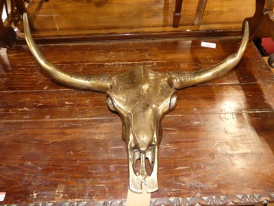 Lot 1336 - A contemporary cast brass wall mounted...