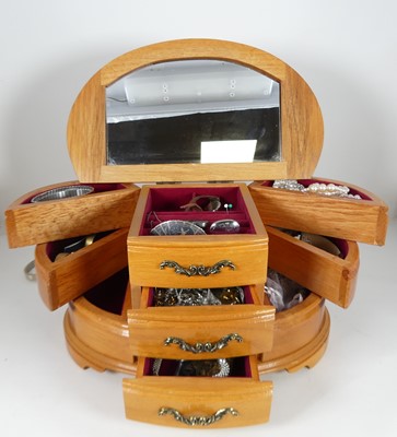 Lot 311 - A modern burr wood bowfront jewellery cabinet,...