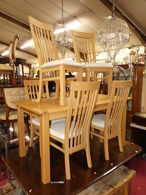 Lot 1339 - A contemporary blond oak dining suite,...