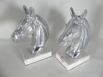 Lot 443 - A pair of contemporary polished metal horse...