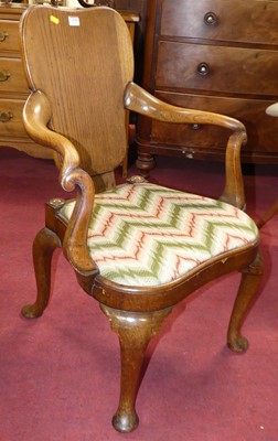 Lot 1378 - An early 20th century oak shaped panel back...