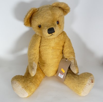 Lot 471 - An early 20th century blond mohair teddy-bear,...