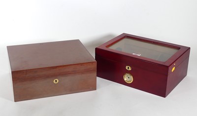 Lot 480 - A lacquered cedar humidor, opening to reveal a...