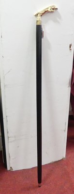 Lot 486 - A reproduction walking stick, the metal handle...