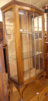 Lot 1410 - A 1920s walnut single door glazed china...