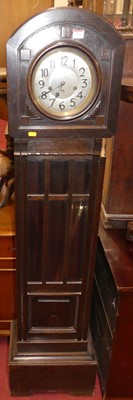 Lot 1414 - A 1930s oak grandmother clock, having a...