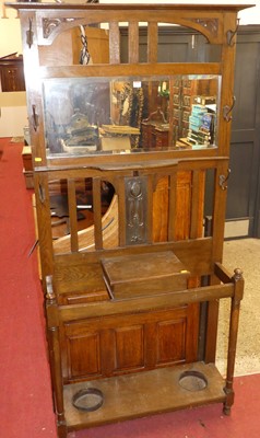 Lot 1415 - An Art Nouveau oak mirror back hall stand,...