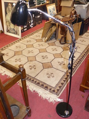 Lot 1416 - A contemporary chromed metal and black painted...