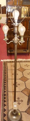 Lot 1429 - A burnished brass freestanding floor light,...