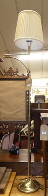 Lot 1431 - A contemporary brushed metal floor light, with...