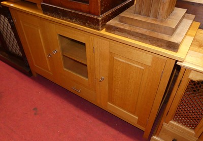 Lot 1436 - A contemporary blond oak three-door sideboard,...